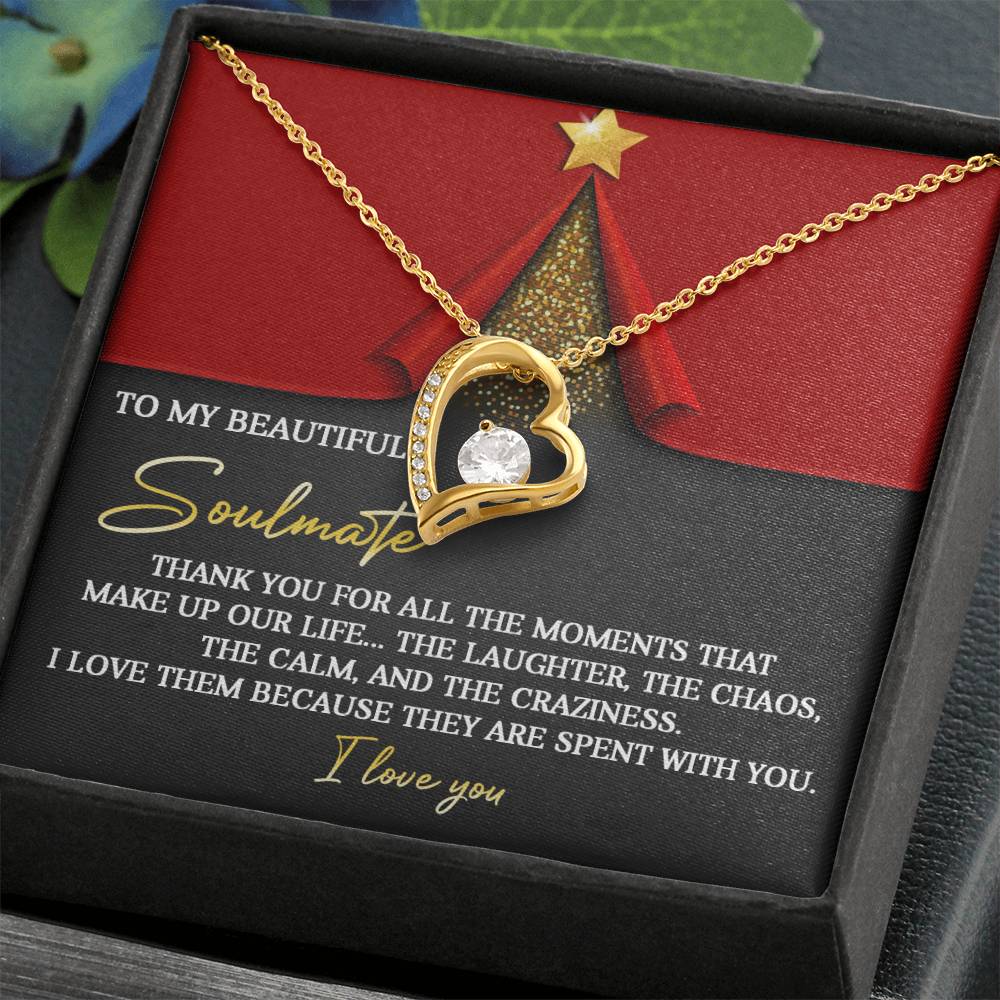 The Soulmate-The Moments - Forever Love Necklace, with its exquisite cubic zirconia gemstone, is beautifully displayed in a black jewelry box. This gold heart-shaped gem is presented alongside a touching message of gratitude and love for a soulmate, embodying the timeless essence of eternal bond and devotion.