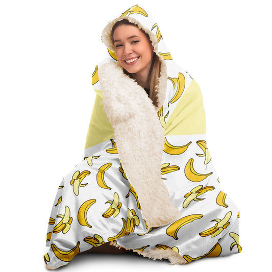 This Nana You're The Best Blanket Hoodie by Subliminator features a silky smooth banana print design.