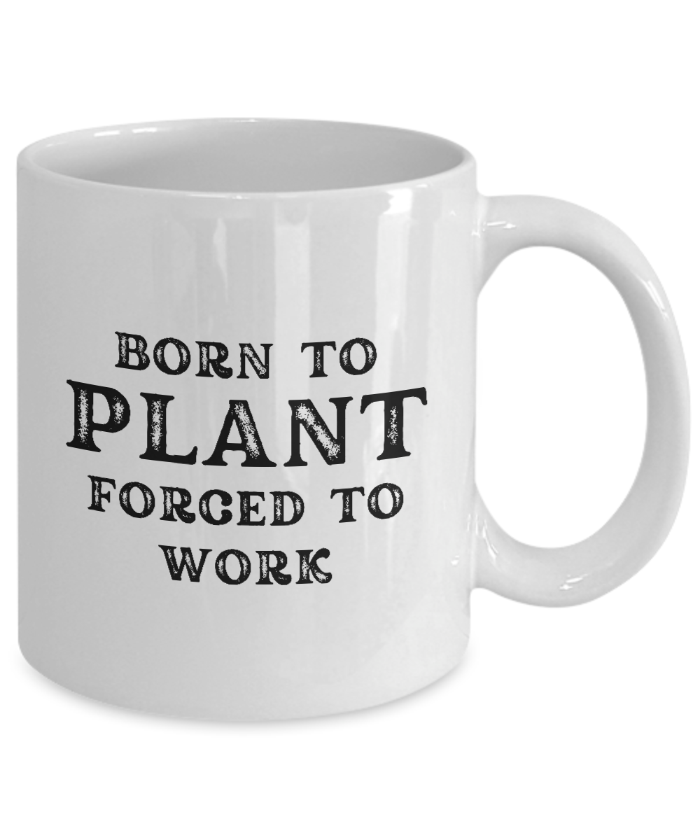 Introducing the "Born to Plant Forced to Work Coffee Mug" – a white ceramic mug featuring black text that reads "Born to Plant, Forced to Work." This unique item, printed and shipped from the USA, is available for a limited time only! Perfect as a gift or an appreciation cup for any gardener.