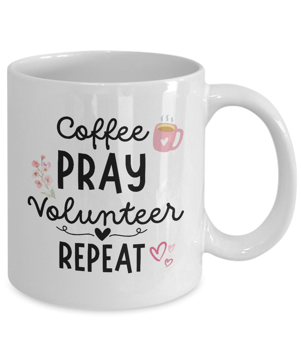 The Coffee Pray Volunteer Repeat Coffee Mug, featuring a coffee cup, flowers, and hearts, is perfect for volunteers. Available for a limited time and printed with care just for you.