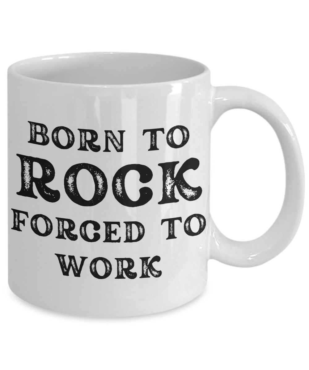 The "Born to Rock Forced to Work" coffee mug, featuring bold black text on a white background, is printed and shipped from the USA. Available for a limited time, it's the perfect gift for any rocker.