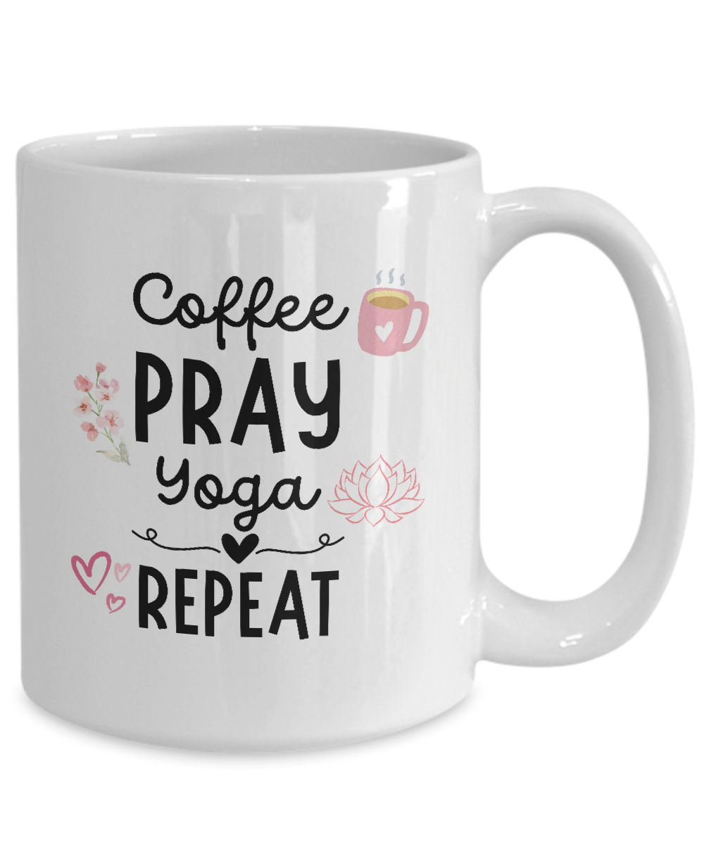 Enhance your mornings with the limited edition "Coffee Pray Yoga Repeat" mug featuring a coffee cup, flowers, lotus, and hearts. Perfect gift for yogis—get yours now!.