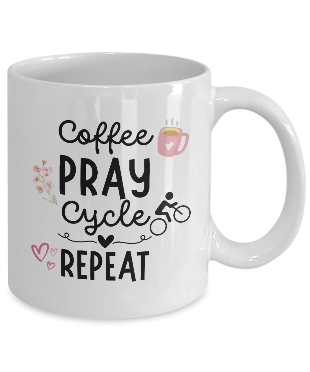 Explore the Coffee Pray Cycle Repeat mug, adorned with a coffee cup, flowers, bicycle, and hearts. Exclusively online for a limited time. Enjoy secure checkout when you order this ideal gift for cyclists today!.