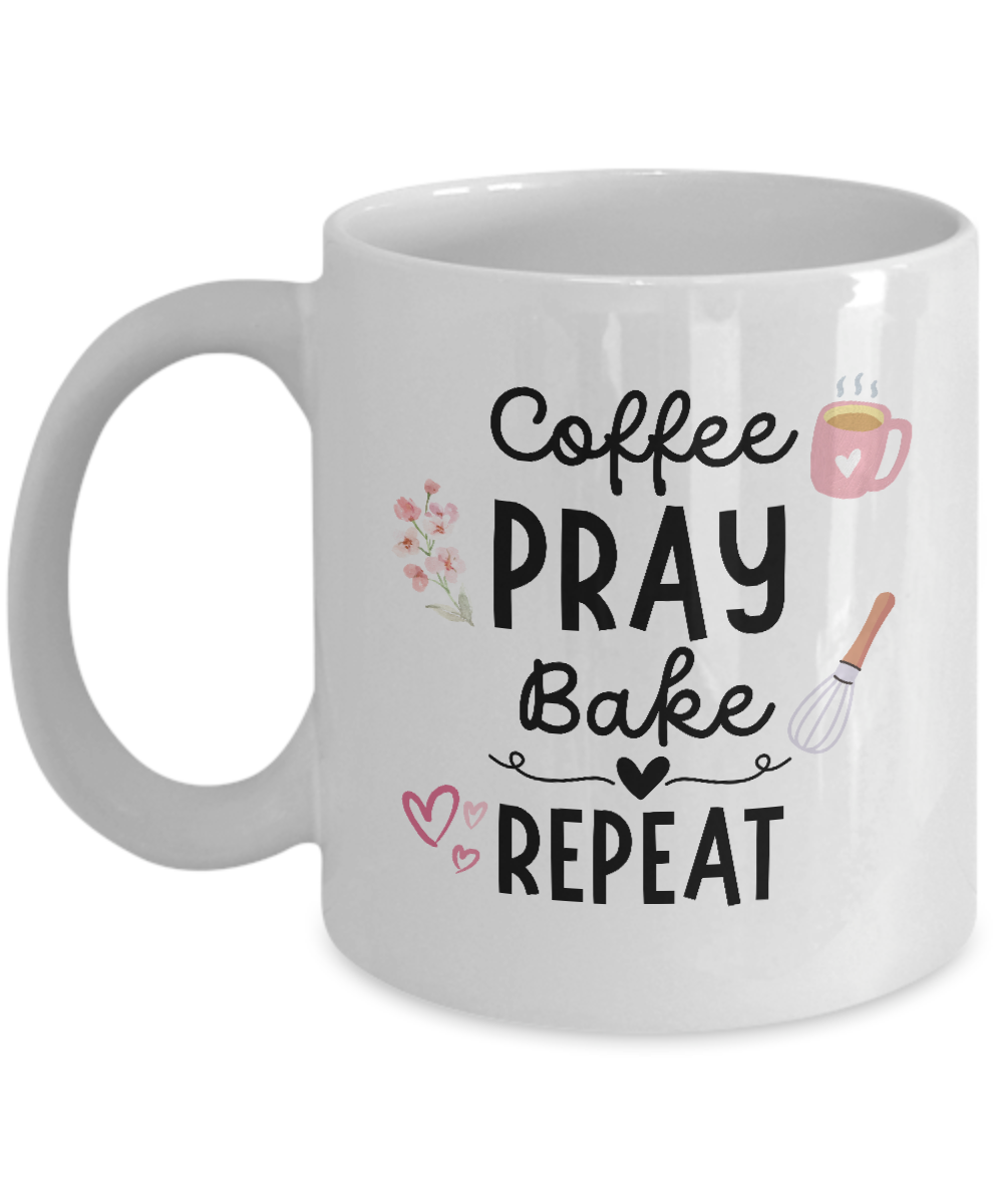 A white ceramic coffee mug featuring illustrations of a coffee cup, flowers, whisk, and hearts. The text on the mug reads: "Coffee, Pray, Bake, Repeat." This limited-time-only item is not available in stores. Product Name: Coffee Pray Bake Repeat Coffee Mug | Best Gift Ideas And Appreciation Cup For Baker.