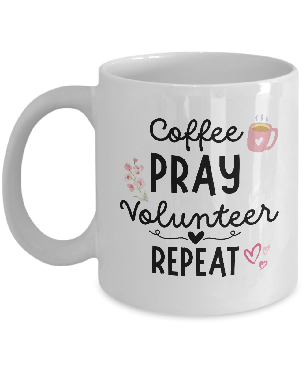 Introducing the JUST RELEASED white coffee mug with the text "Coffee, Pray, Volunteer, Repeat" and charming illustrations of a coffee cup, flowers, and hearts. The Coffee Pray Volunteer Repeat Coffee Mug is the perfect appreciation gift for volunteers and is NOT available in stores!