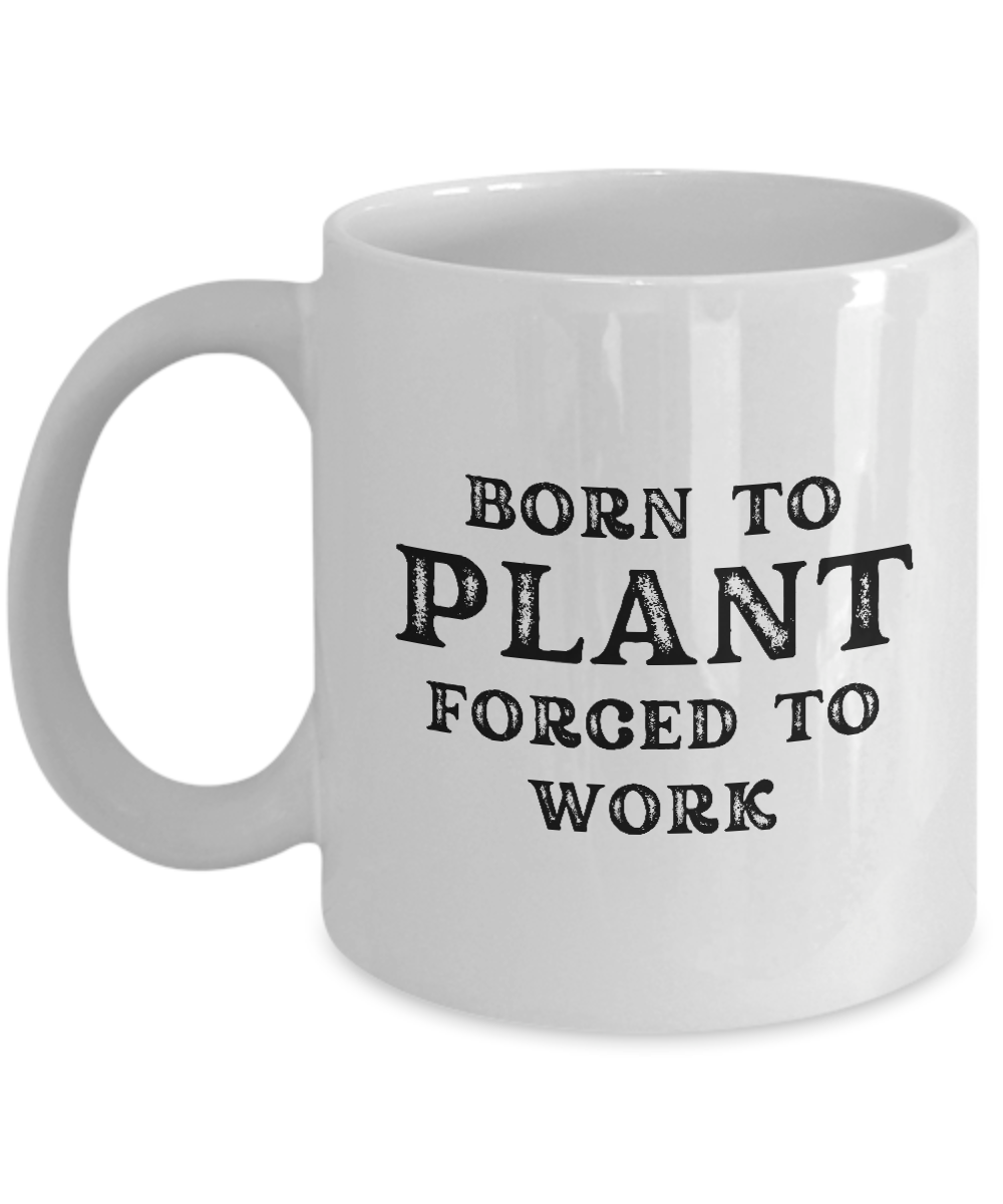 Introducing the "Born to Plant Forced to Work Coffee Mug" – a white ceramic mug featuring black text that reads "Born to Plant, Forced to Work." This unique item, printed and shipped from the USA, is available for a limited time only! Perfect as a gift or an appreciation cup for any gardener.