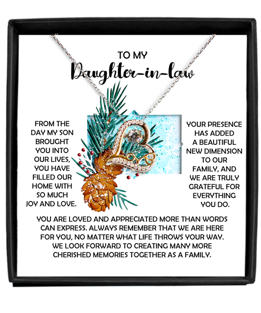 Introducing the Daughter-in-Law-Here For You - Love Dancing Necklace gift box, featuring a heartfelt message to convey love, appreciation, and gratitude to your daughter-in-law. Adorned with a charming pinecone and foliage design, this elegant piece is available in either 14k gold or Sterling Silver.