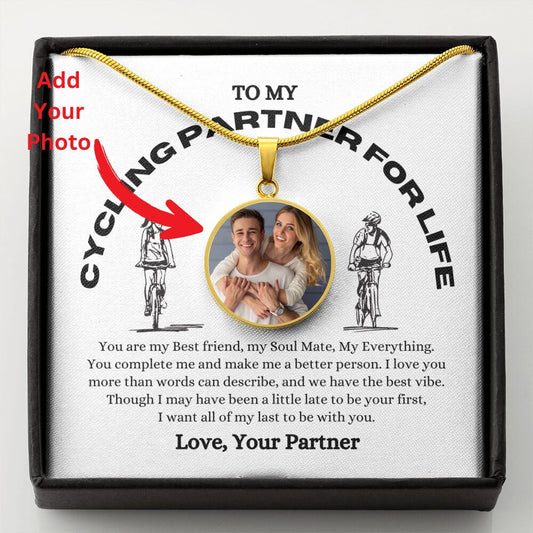 A Custom Photo Pendant Necklace With Message Card displayed in a box with a custom photo pendant and a printed message dedicated to a cycling partner, signed "love, your partner.