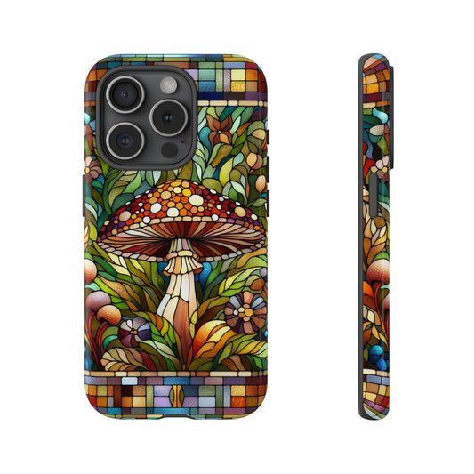 The Cottagecore Forest Mushrooms Faux Stained Glass Phone Case, available for iPhone 15, 14, 13, Samsung Galaxy, and Pixel devices, showcases a vibrant stained-glass design adorned with mushrooms and floral patterns. This case is displayed from front and side angles and makes an ideal gift for any mushroom lover.