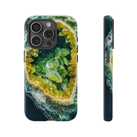 Front view and side view of an iphone 15 Pro August Birthstone Peridot Crystal Geode Design Phone Case, featuring a stunning geode design that integrates vibrant yellow, green, and white crystalline structures that offer aesthetic appeal.