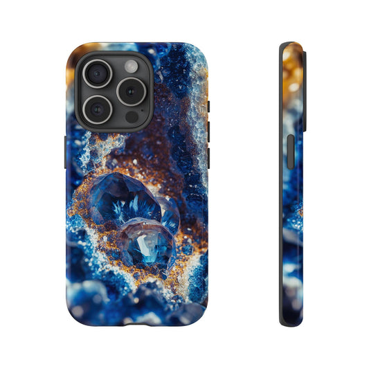 Front view and side view of an iphone 15 Pro September Birthstone Sapphire Crystal Geode Design Phone Case featuring a close-up of a geode revealing its inner beauty in shades of blue and hints of rusty gold.