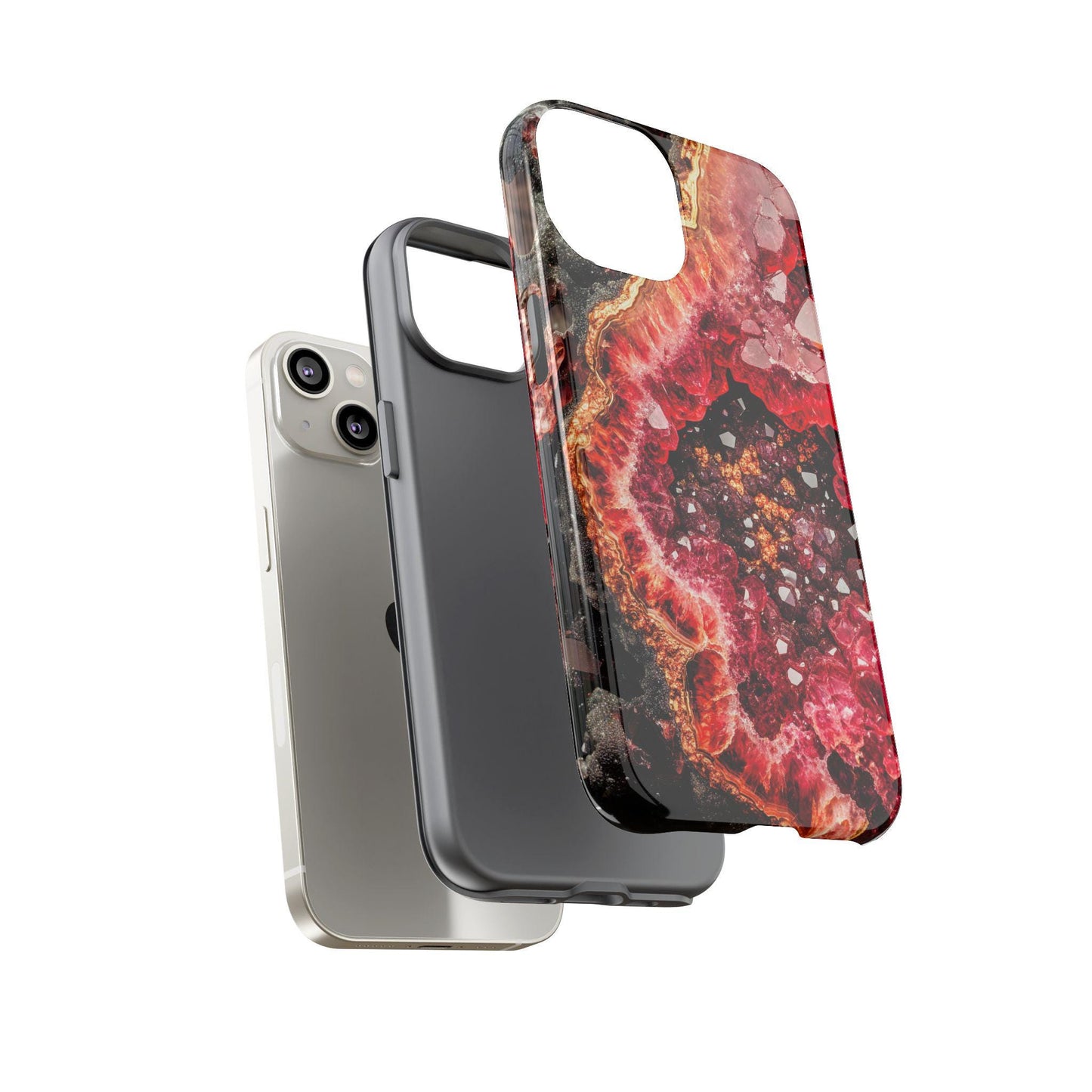 Smartphone with two interchangeable cases, featuring a sleek plain gray design and the January Birthstone Garnet Crystal Geode Design Phone Case in red and pink, displayed against a plain background.