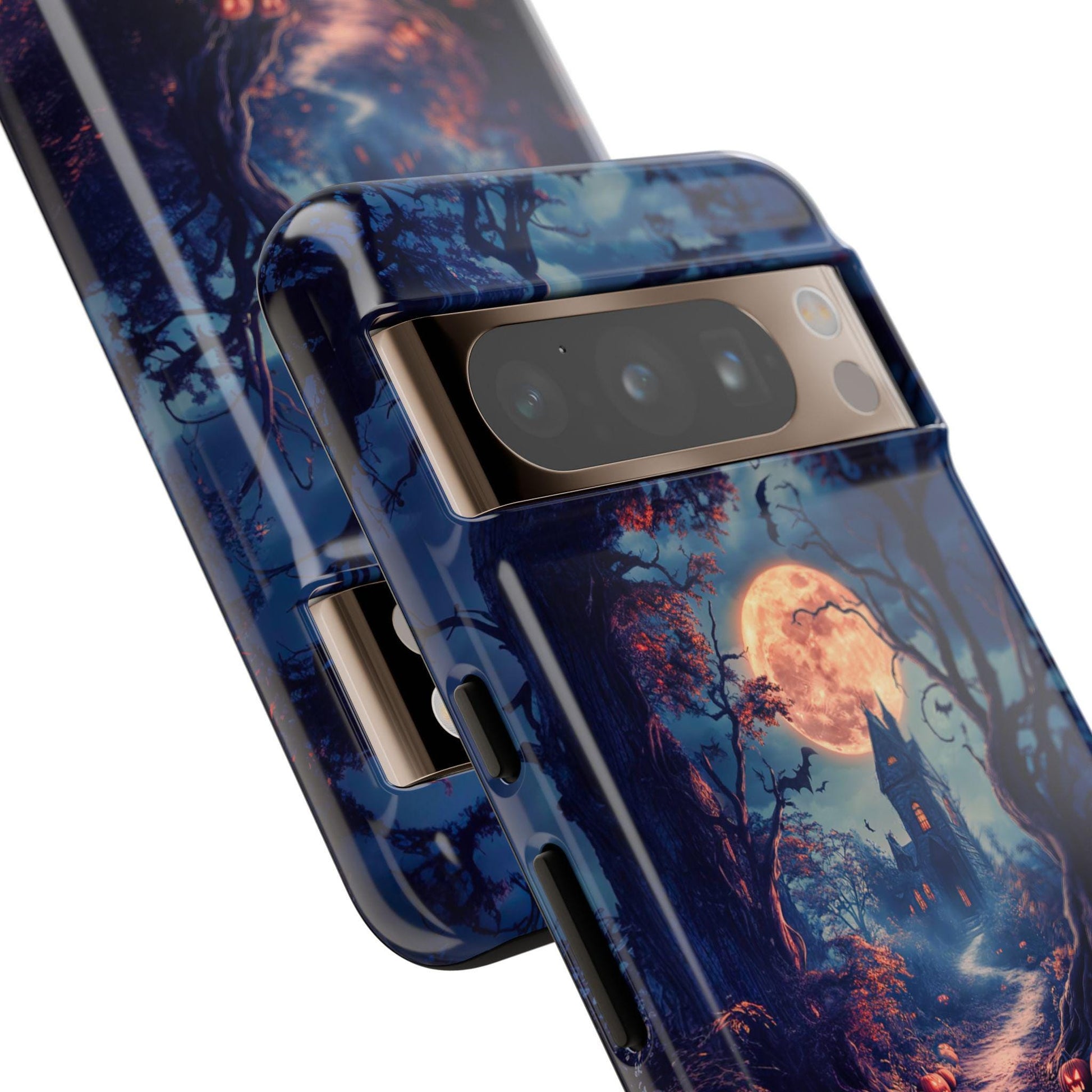 Close-up of a Halloween phone case featuring the Haunted Mansion design, which displays a spooky scene with a full moon, twisted trees, and a silhouetted Gothic-style mansion.