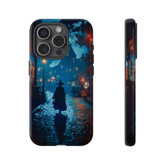 An iPhone 15 Pro case showcasing a spellbinding scene of a witch strolling through a Halloween town. The soft glow from street lamps and moonlight playfully reflects off the rain-soaked path, creating an eerie yet captivating ambiance.