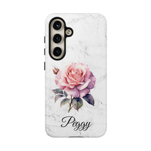 This personalized gift showcases the "Personalized Birth Flower Phone Case, Unique Custom Name Cover For iPhone Samsung Google, Birth Month Flower Gift For Her, Tough Phone Case," featuring a beautiful pink rose birth flower and the name "Peggy" elegantly printed on a white marble background.