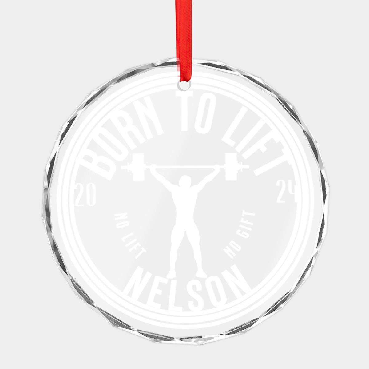 Custom Weightlifting CRYSTAL GLASS Ornament adorned with "Born to Lift" text, a silhouette of a weightlifter, and bold white "Nelson 2024" lettering. Finished with a red ribbon, this ornament is the perfect gym Christmas gift for any bodybuilder enthusiast.