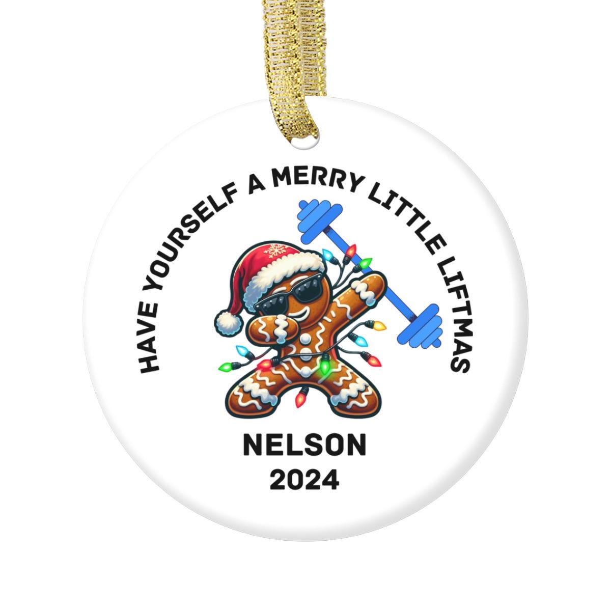 A white Merry Liftmas Weightlifting Ceramic Ornament featuring a playful gingerbread man in a Santa hat & sunglasses, & lifting a barbell adorned with Christmas light bulbs. The phrase &quot;HAVE YOURSELF A MERRY LITTLE LIFTMAS&quot; and Nelson 2024.