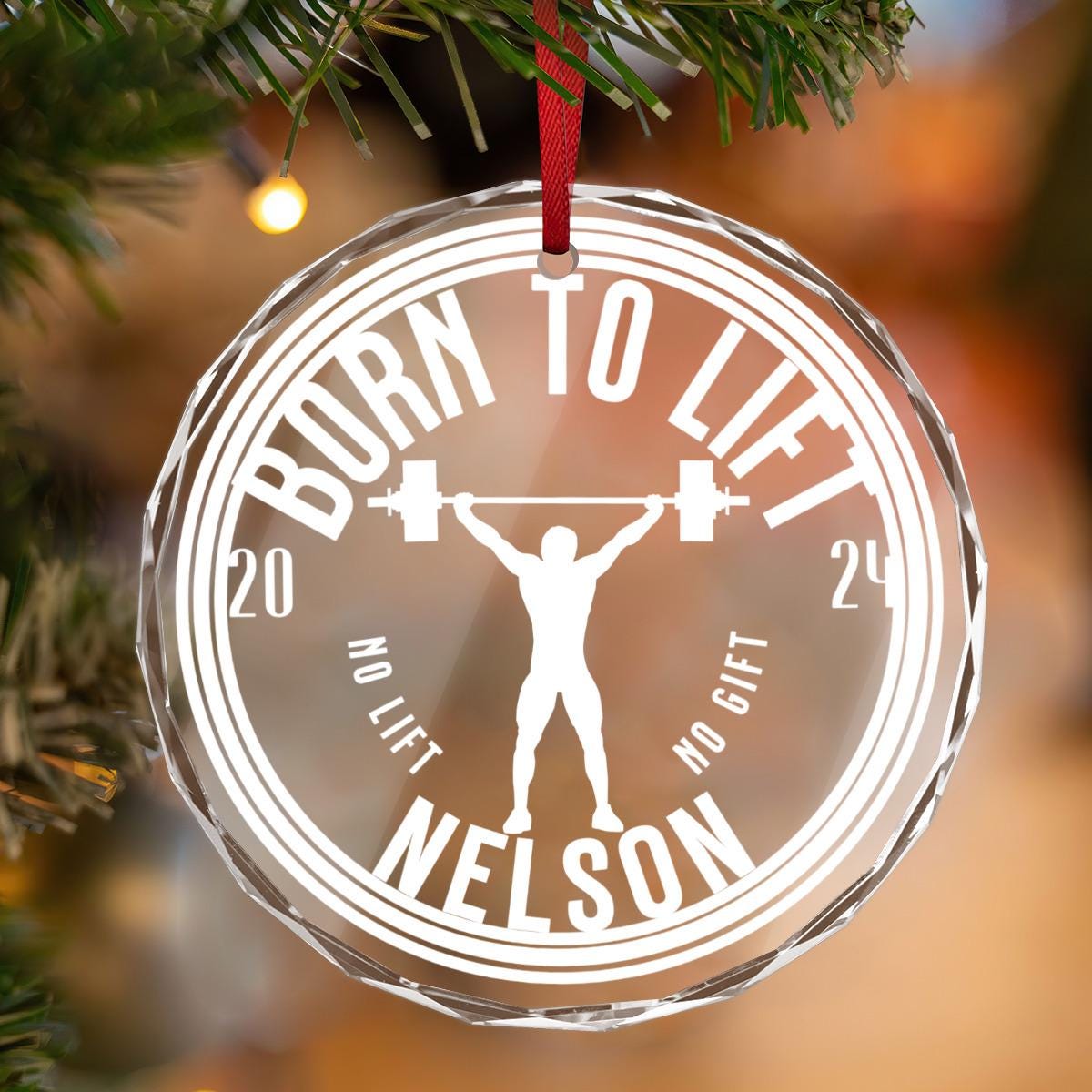 A Custom Weightlifting Crystal Glass Ornament showcases a weightlifting silhouette alongside the phrases: "Born to Lift," "Nelson," and "2024 No Lift No Gift." This ideal Christmas gift for bodybuilders, weightlifters, swole mates, and gym enthusiasts will hang proudly on the tree as a tribute to strength and dedication.