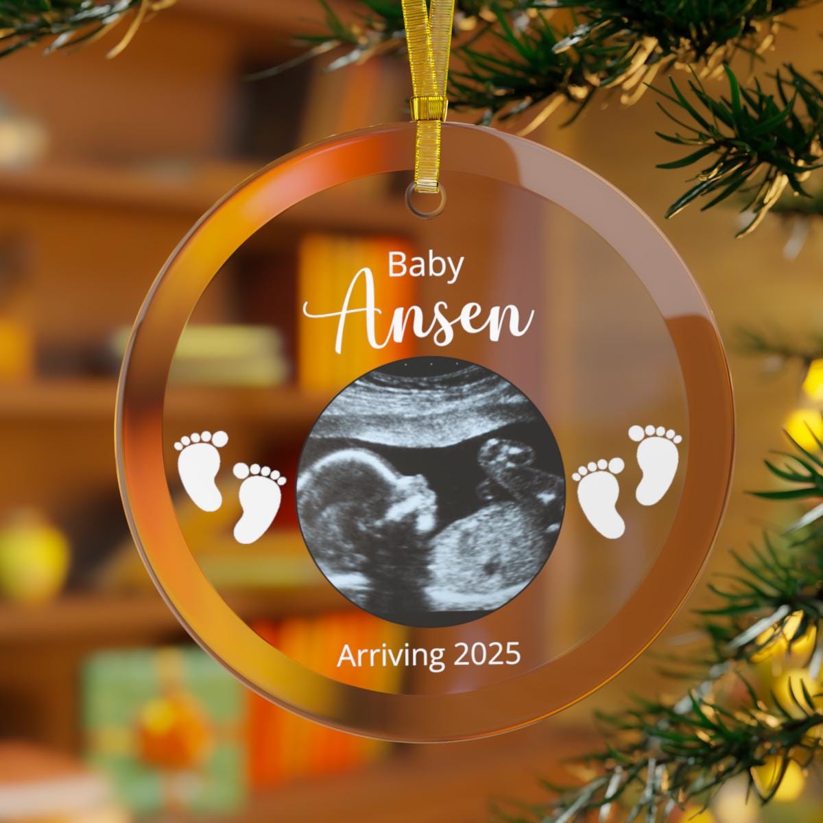 This Custom Ultrasound Photo GLASS Ornament displays a charming sonogram picture encircled by little footprints, featuring the text "Baby Ansen" and "Arriving 2025." It's an ideal pregnancy announcement ornament for your Christmas tree.