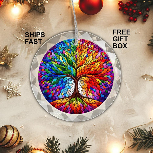A round ornament named the Celtic Tree of Life GLASS Ornament by Golden Value SG, featuring a vibrant tree design set against a white festive backdrop adorned with pine branches, stars, and gold  and red ornaments.