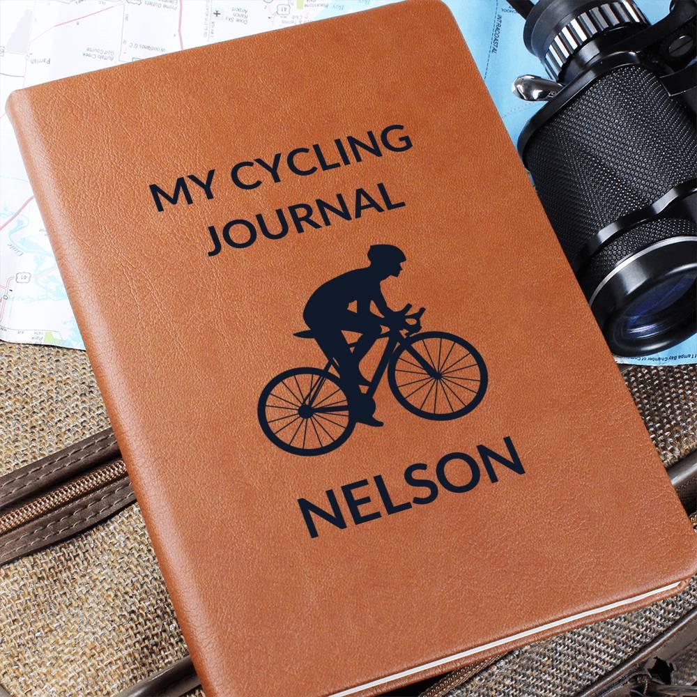 The Personalized Leather Cycling Journal For Men features your custom name, a ribbon bookmark, and a cyclist silhouette—perfect as a gift or log book for road bikers, bike lovers, and cycling enthusiasts.
