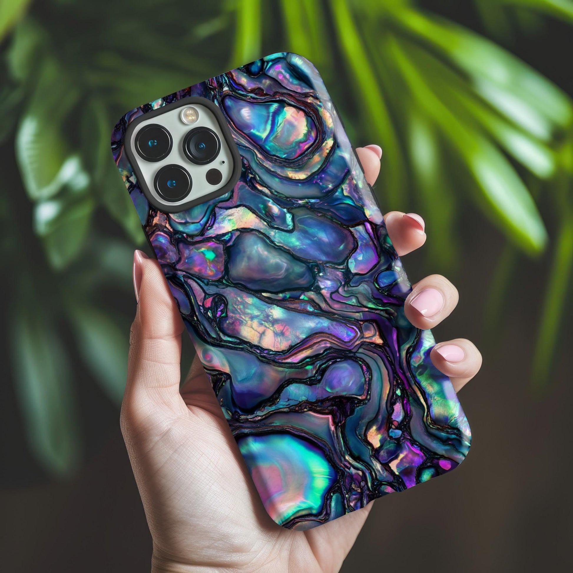 Abalone Phone Case by Golden Value SG featuring vibrant abstract pattern like abalone shell or polished opal. Features flowing organic shapes with blues, purples, and greens, creating a shimmering, lustrous effect.