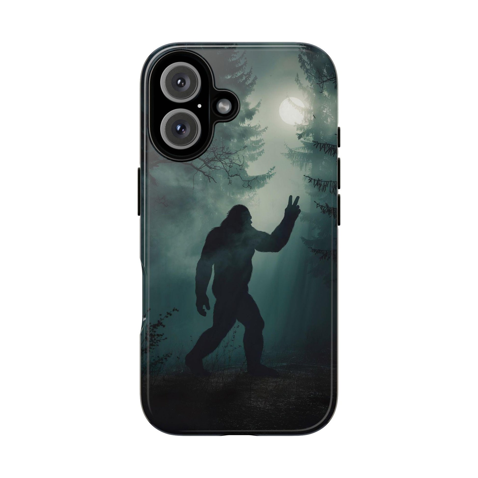The Bigfoot Silhouette Phone Case by Golden Value SG features a shadowy, forested scene at night with a full moon casting an eerie glow through the trees. In the foreground, a large, hairy, humanoid figure resembling Bigfoot or Sasquatch is silhouetted against the moonlight. The creature is standing upright, with one arm raised, making a peace sign with its hand. The atmosphere is misty and mysterious, with tall pine trees and bare branches adding to the spooky ambiance.