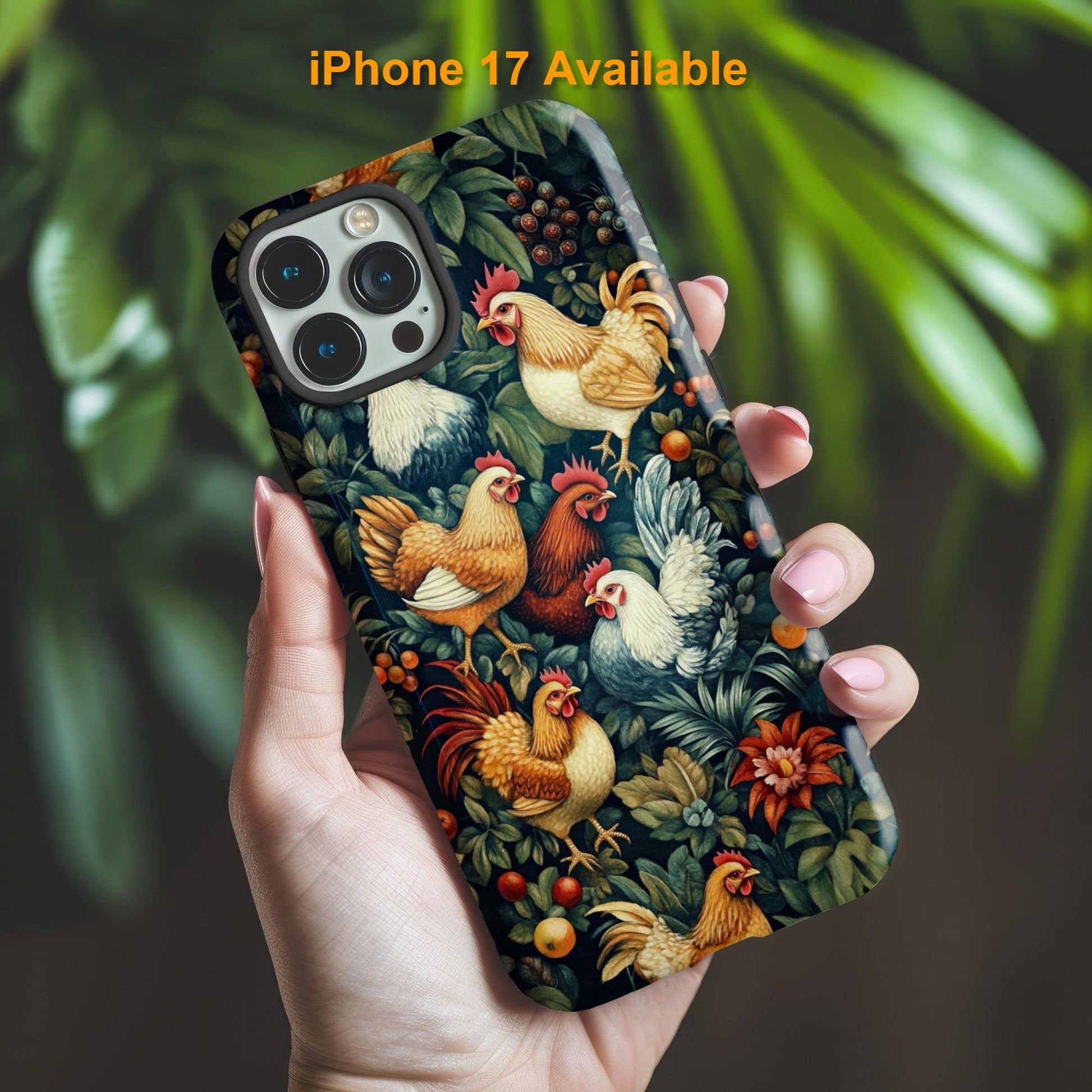 A hand holds the a vibrant Chicken Phone Case from Golden Value SG features colorful roosters and hens amid lush foliage and fruit, with blurred green leaves in the background.
