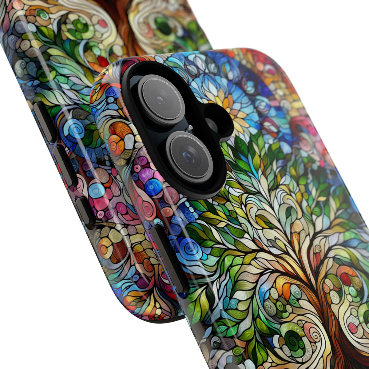 Close-up angled view of two colorful stained-glass style phone cases featuring a tree design.