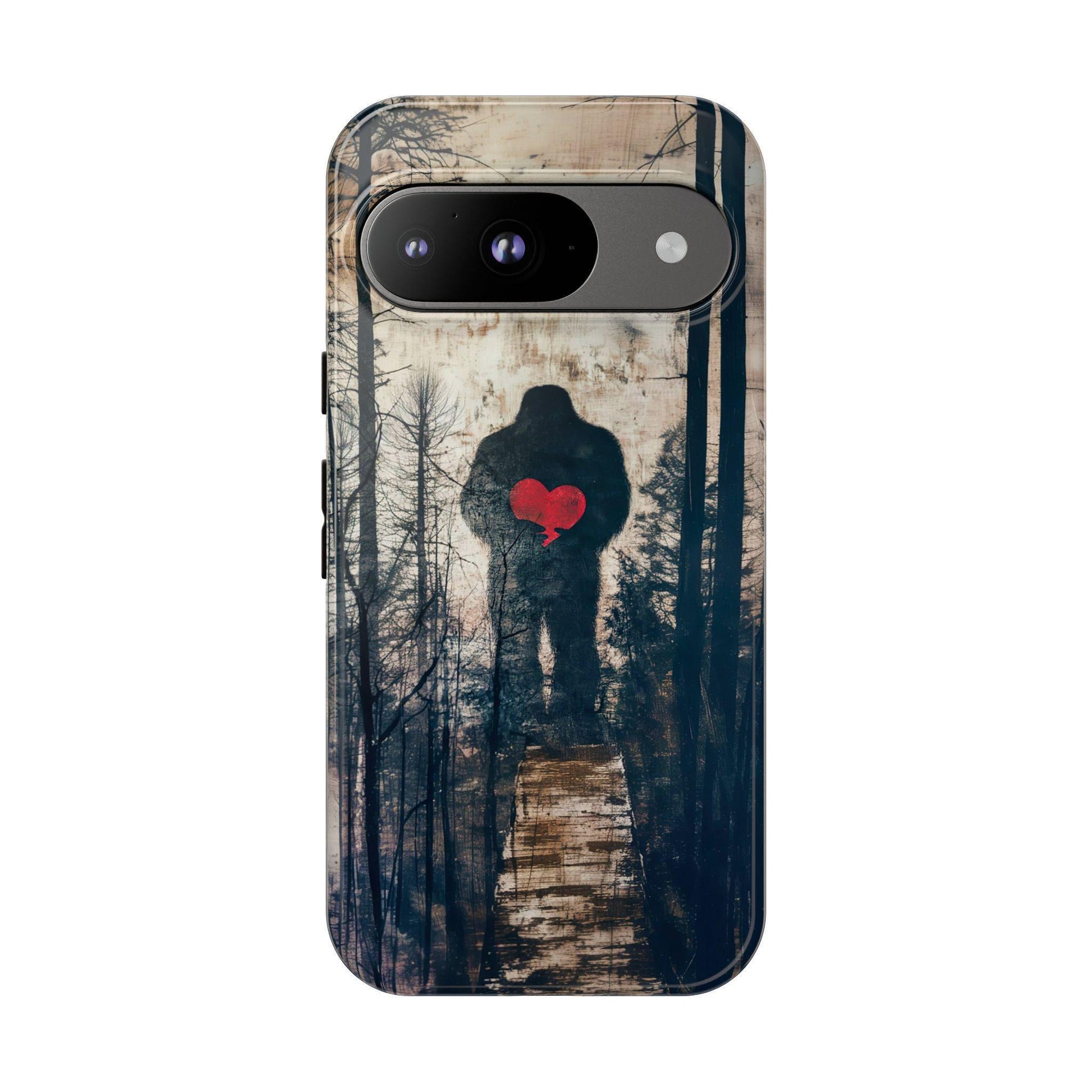 A phone case featuring a dark silhouette of Bigfoot holding a red heart against a wooded forest background with a wooden path.