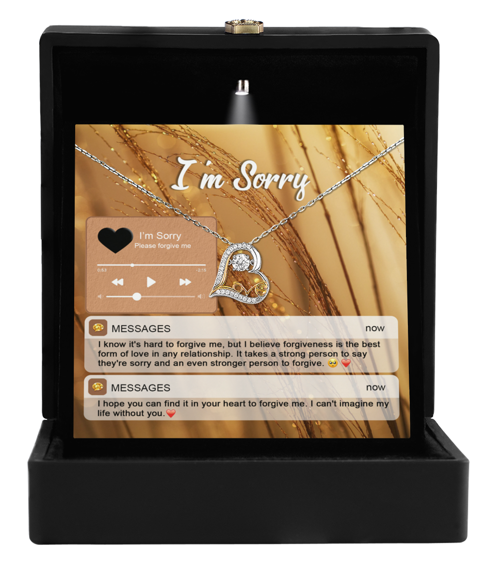 The jewelry gift box includes the Sorry-Person To Forgive - Love Dancing Necklace, a gold-plated heart-shaped pendant with an apologetic message card featuring text and icons, perfect for expressing heartfelt sentiments.