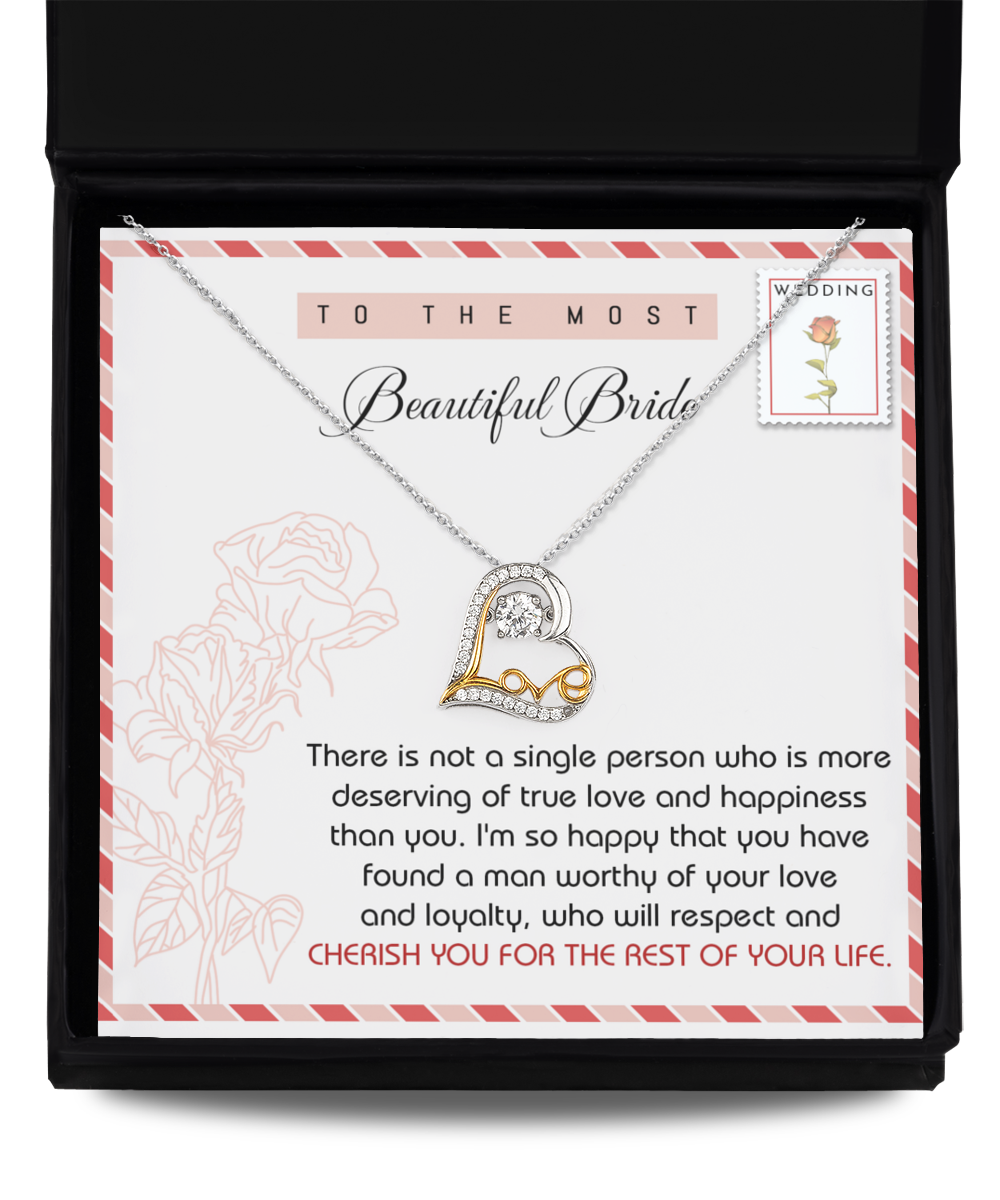 A Bride-Of Your Life - Love Dancing Necklace is displayed in an open black box. The sterling silver hypoallergenic necklace features text addressed to a bride, expressing love and congratulations.