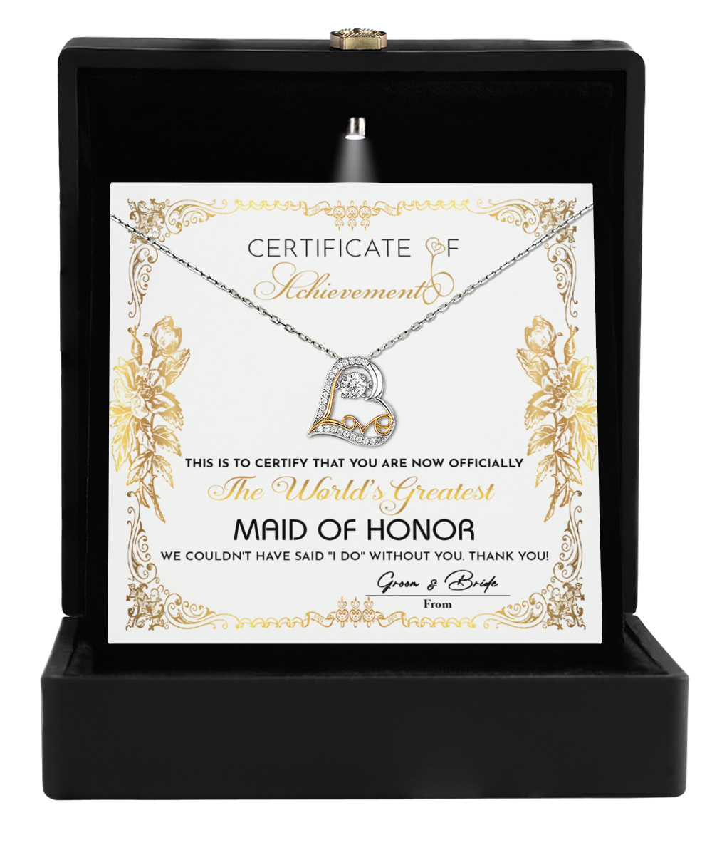 Elegantly presented in a sleek black box, the "To Maid Of Honor-Certificate Of Achievement - Love Dancing Necklace" showcases a beautiful 14k gold necklace with a heart pendant that dances with love. Inside, you'll find a certificate declaring "World's Greatest Maid of Honor," making it an ideal gift for your Maid of Honor.