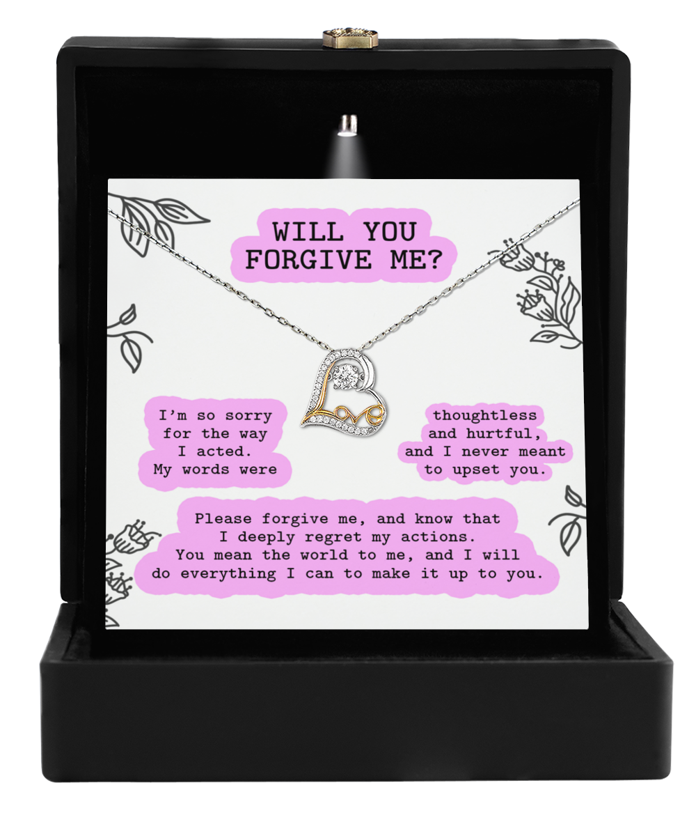 The "Sorry-Never Meant To - Love Dancing Necklace" is a hypoallergenic sterling silver necklace presented in a black box, accompanied by a heartfelt message reading "Will you forgive me?" and an apology note expressing regret and asking for forgiveness.