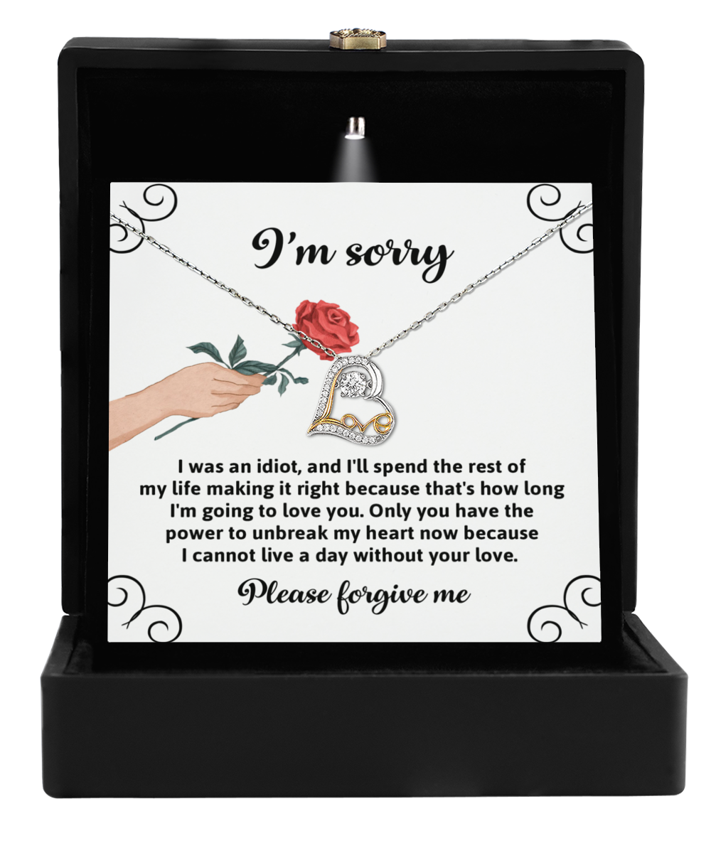 The "Sorry-Making It Right - Love Dancing Necklace" features a heart-shaped pendant gracefully nestled in a gift box. Crafted in 14k gold, it shimmers softly, holding a heartfelt apology and sincere plea for forgiveness.