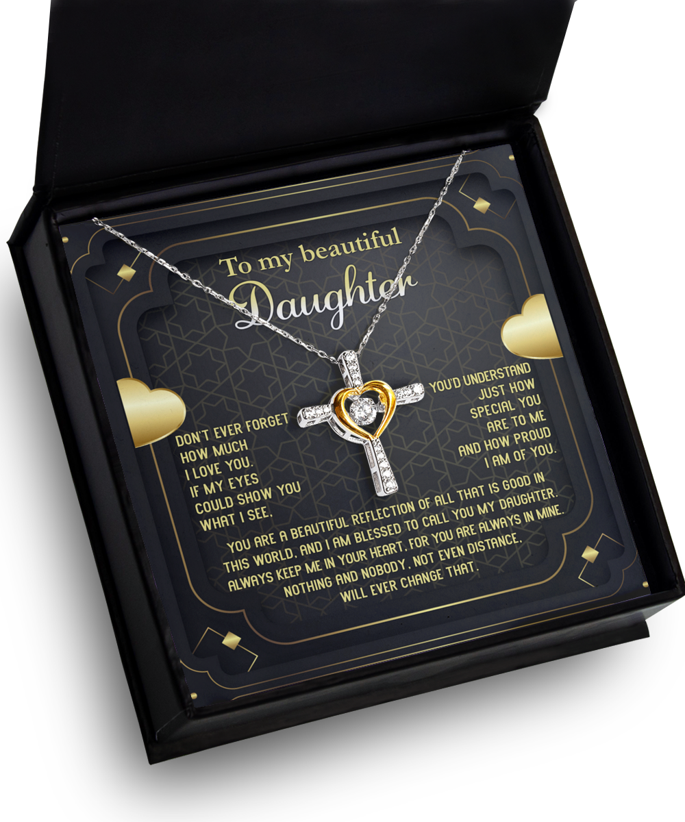 The To Daughter-Beautiful Reflection - Cross Dancing Necklace is presented in a black gift box with an emotional message for a daughter. This .925 Sterling Silver necklace features a cross and heart design with a central 14k gold heart. The message inside expresses love, pride, and reassurance, surrounded by heart decorations.