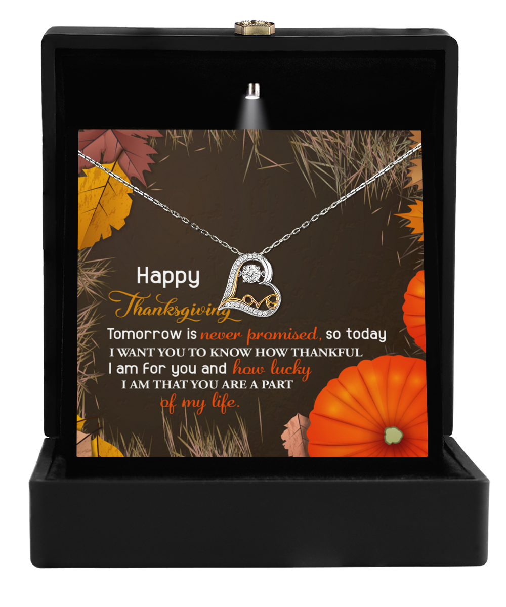 The Thanksgiving-How Lucky Love Dancing Necklace is elegantly packaged in a sleek black box and includes a heartfelt Thanksgiving message card adorned with pumpkins. Inside, you'll find the necklace featuring a heart-shaped pendant crafted from shimmering sterling silver.