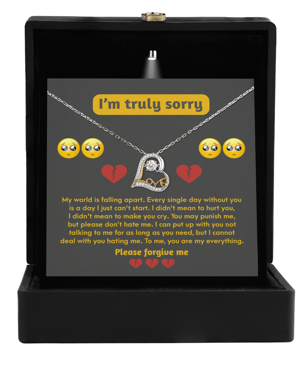 A Sorry-Make You Cry - Love Dancing Necklace, crafted in sterling silver and presented inside a black jewelry box, features a heartfelt apology message adorned with crying and broken heart emojis, adding an emotional touch to this thoughtful gift.