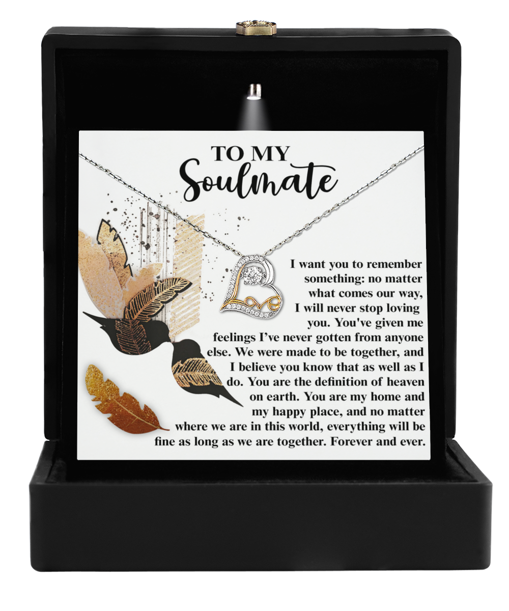 The Soulmate-Given Me Feelings - Love Dancing Necklace is elegantly crafted in .925 Sterling Silver and comes in a box accompanied by a card titled "To My Soulmate," which features a heartfelt message alongside a floral design.