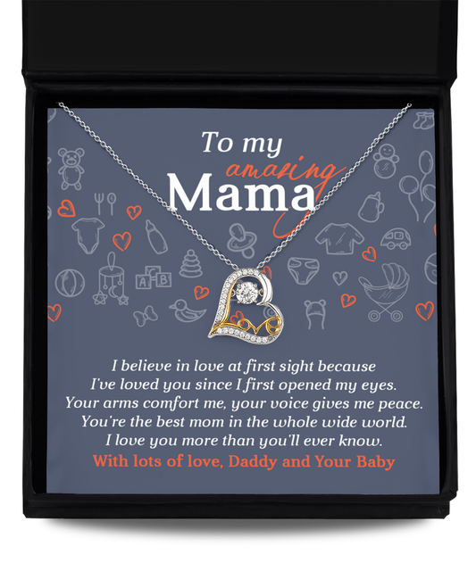A To Mom To Be, At First Sight - Love Dancing Necklace in a gift box with an inscription for "mom" featuring a heart-shaped pendant, accompanied by a loving message from "daddy and your baby.