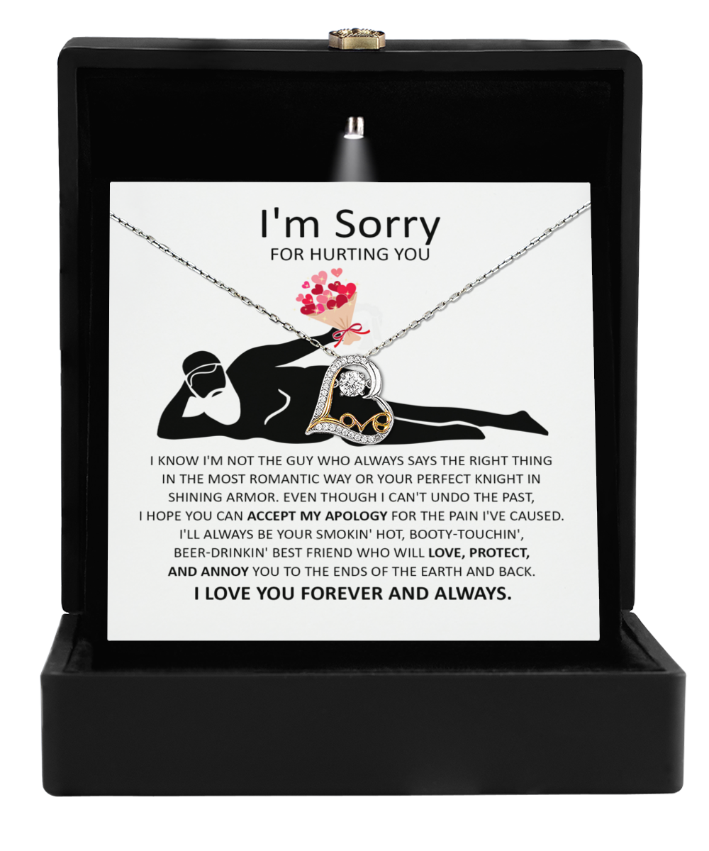 The Sorry-The Most Romantic - Love Dancing Necklace, crafted in 14k gold with interlocking rings, is elegantly presented in a sleek black box. It includes an apology card that features a silhouette of a reclining man and heartfelt text conveying regret and love.