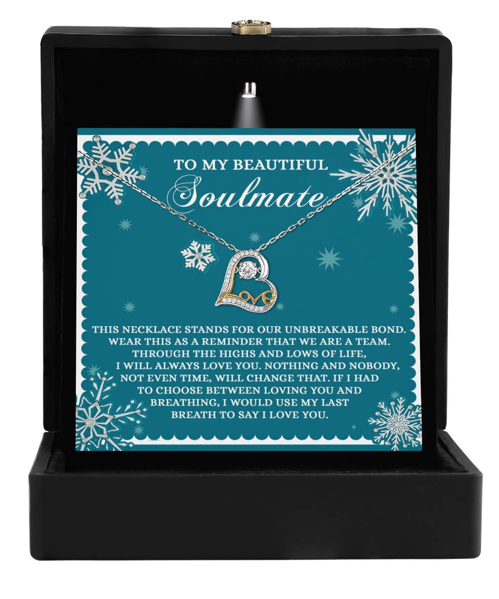 The Soulmate-A Team - Love Dancing Necklace, featuring a "Love" pendant and crafted in sterling silver, is elegantly displayed in an open black box. The message reads, "To my beautiful soulmate," accompanied by a heartfelt note about love and commitment.