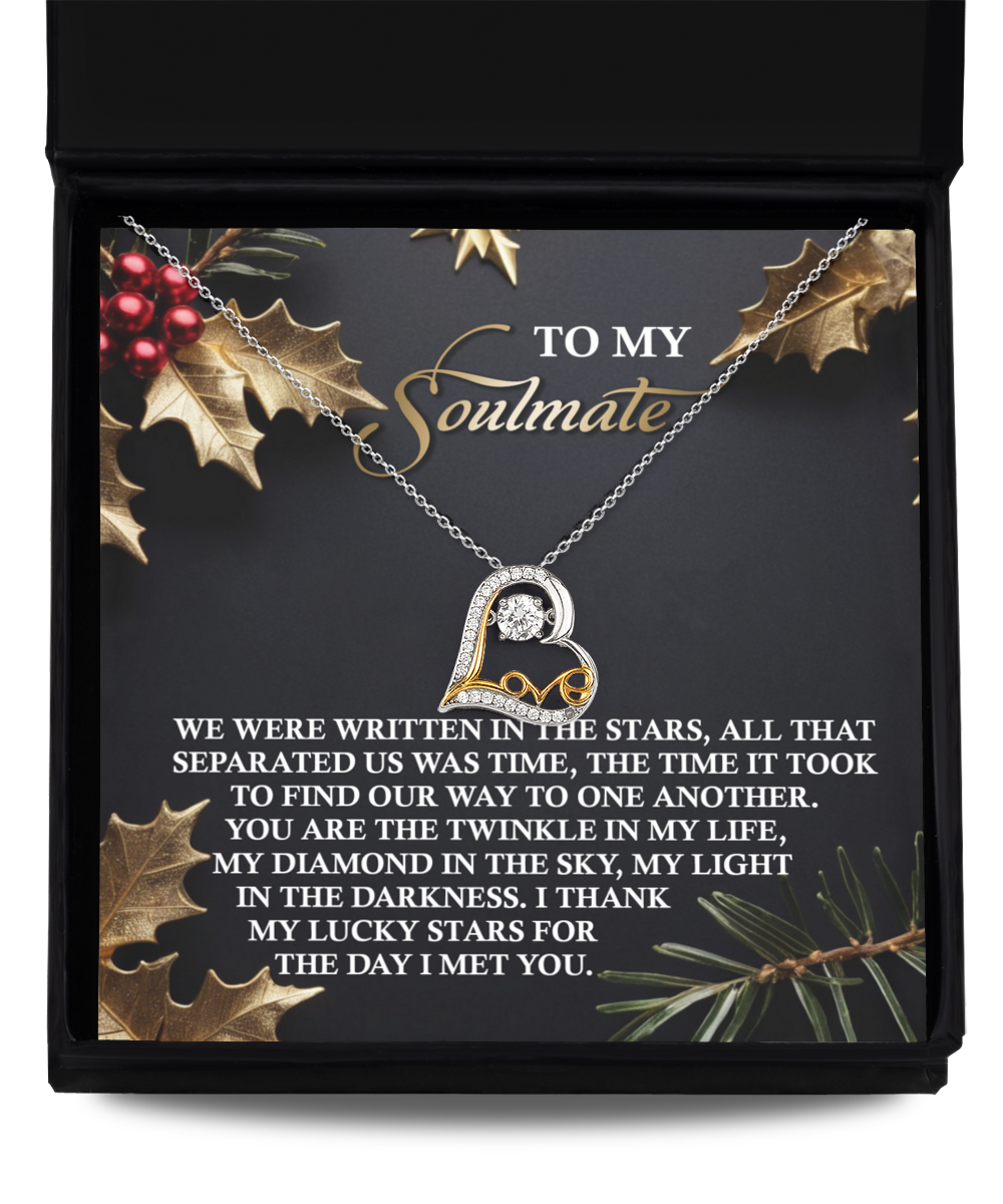 The Soulmate-In The Stars - Love Dancing Necklace features a heart-shaped design and comes on a message card decorated with holly and pine, reading: "To my soulmate... I thank my lucky stars for the day I met you." Available in 14k gold or sterling silver, it embodies timeless elegance.