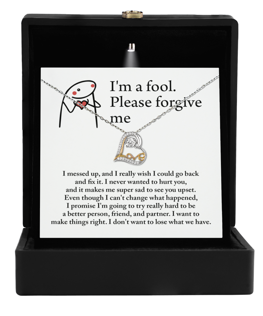 Inside a sleek black box, the Sorry-Make Things Right - Love Dancing Necklace rests elegantly on an apology card with a simple stick figure drawing, creating an unforgettable gesture for someone special.