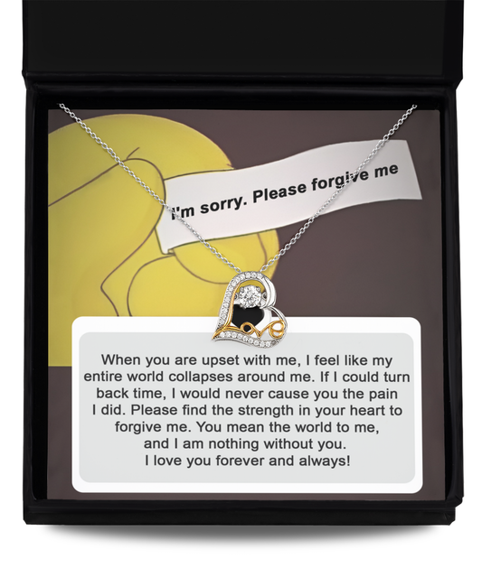 The "Sorry-Nothing Without You - Love Dancing Necklace," a 14k gold necklace with a heart-shaped pendant, is beautifully placed on top of a card bearing an apology note and a heartfelt message about seeking forgiveness and expressing deep love.