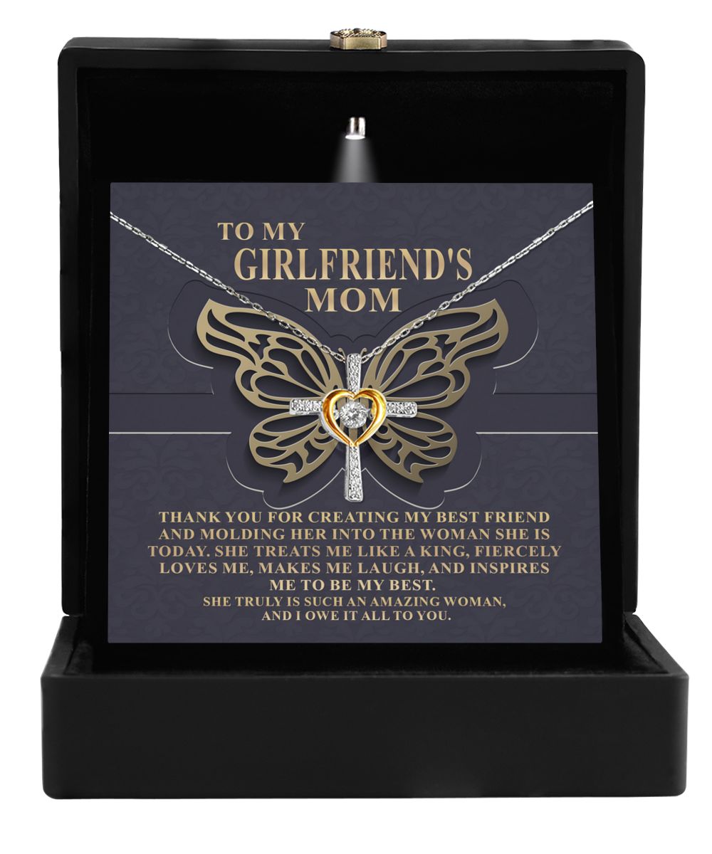 A To Girlfriend's Mom, Be My Best - Cross Dancing Necklace in a gift box with a sentimental message for a girlfriend's mother, now crafted as a 14k gold plated necklace by Gearbubble.