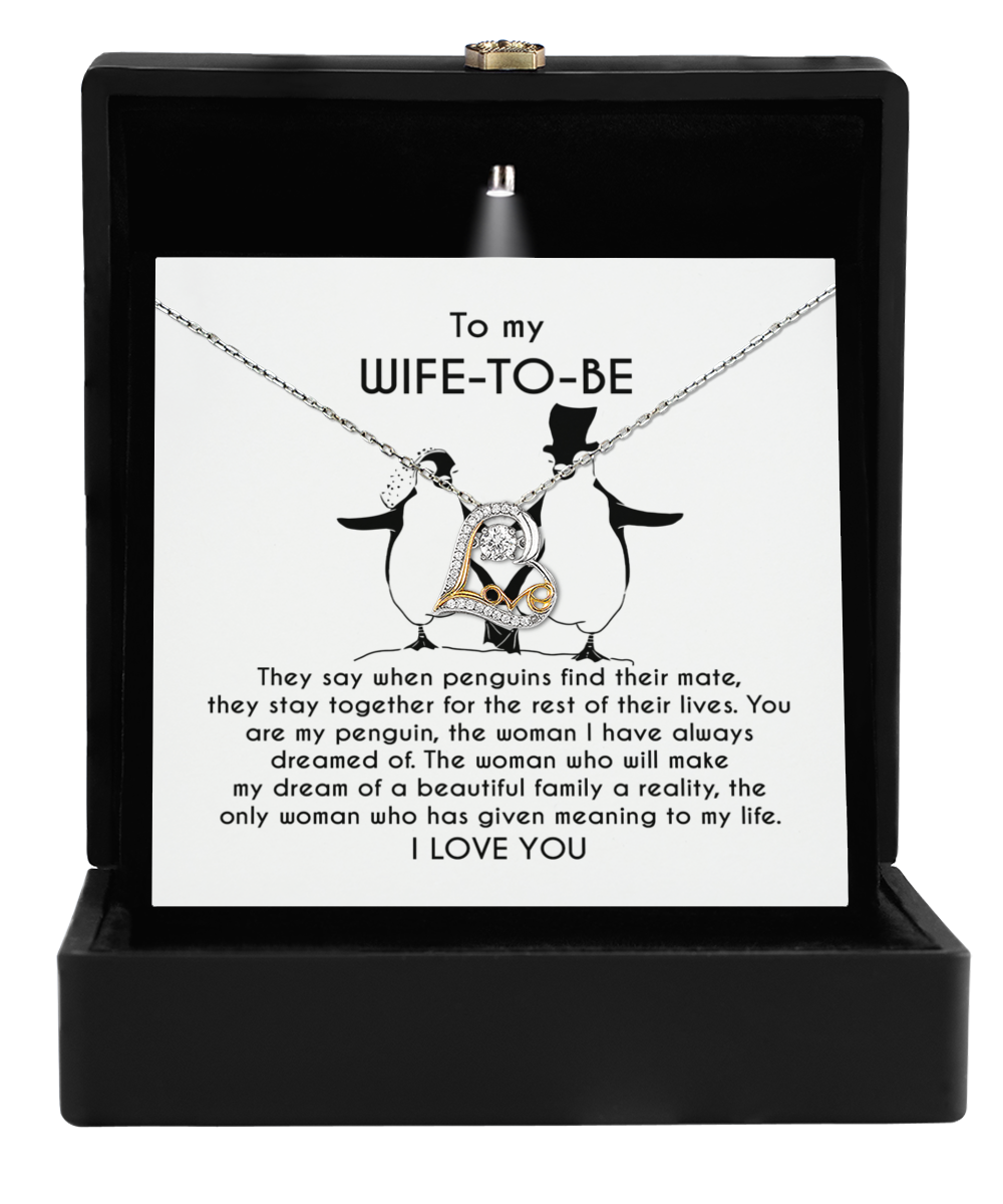 The stunning Wife-to-be-My Penguin - Love Dancing Necklace, made of 14k gold and featuring an adorable penguin design, arrives stylishly boxed with a heartfelt message for your fiancé. It's the ideal necklace to cherish forever.