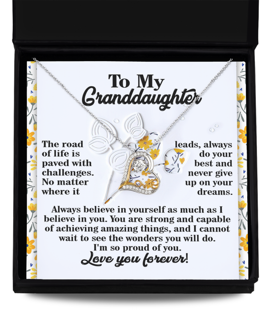 The Granddaughter-On Your Dreams - Love Dancing Necklace beautifully showcases a heart, infinity symbol, and a touching message for your granddaughter in an enchanting box. This exquisite piece is embellished with floral designs framing the heartfelt words and is available in stunning 14k Gold or elegant Sterling Silver.