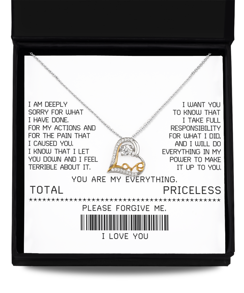 A Sorry-Make It Up - Love Dancing Necklace features an interlocking heart pendant on a white card with an apology message and phrases such as "YOU ARE MY EVERYTHING" and "PLEASE FORGIVE ME" printed in black text.