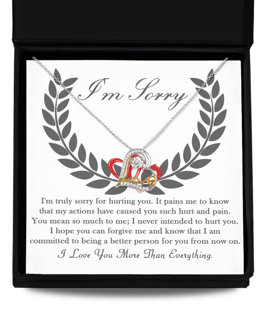 A genuine Sterling Silver "Sorry-From Now On - Love Dancing Necklace" with a heart and infinity symbol pendant is displayed in an open box. The inner lid contains an "I'm Sorry" message, expressing regret, love, and a commitment to improve.